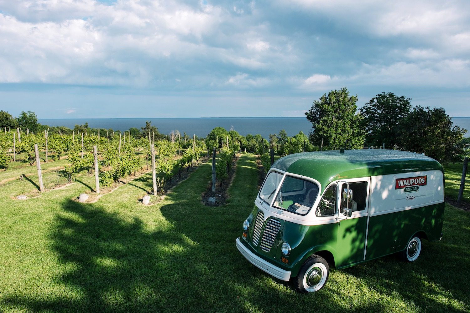 County Cider’s vintage van overlooking the orchard and Lake Ontario